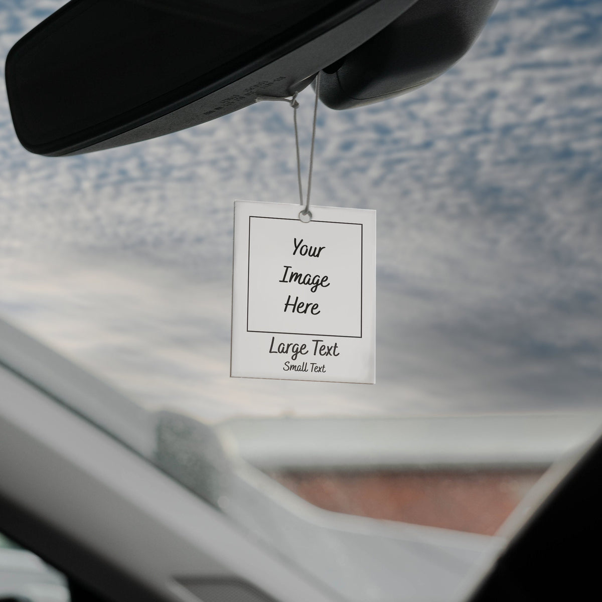 White car air freshener with a string hanging from the top. The air freshener has a white background with black text that says "Your Image Here" and "Large Text Small Text".