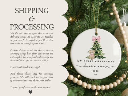 May include: A round white ceramic ornament featuring a watercolor illustration of a green Christmas tree topped with a pink gingham bow and a small teddy bear. The text reads MY FIRST CHRISTMAS, harper maria, and 2025 with a small heart icon.