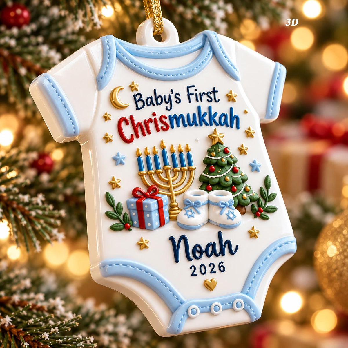 May include: A white baby bodysuit ornament with light blue trim featuring the text Baby's First Chrismukkah, a gold menorah, a decorated Christmas tree, a blue gift box, and white baby shoes. The name Noah and the year 2026 are printed below.