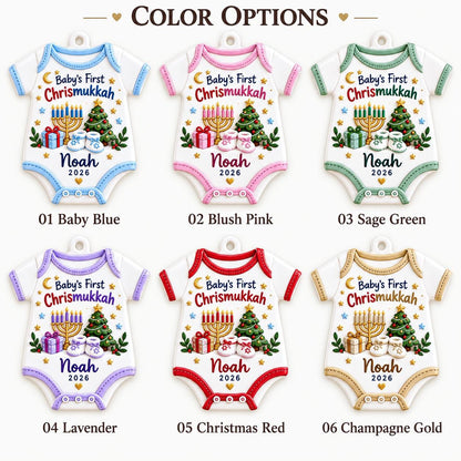 May include: Six white baby onesie ornaments with colored trim in baby blue, blush pink, sage green, lavender, Christmas red, and champagne gold. Each features a menorah, Christmas tree, gifts, baby shoes, and the text Baby's First Chrismukkah Noah 2026.