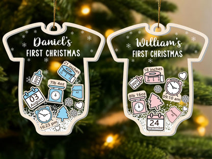 May include: Two baby onesie-shaped Christmas ornaments. One reads "Daniel's FIRST CHRISTMAS" with birth details: 21 inches, 7lb 4oz, August 3, 16:23 pm. The other reads "William's FIRST CHRISTMAS" with birth details: 18 inches, 8lb 16oz, September 24, 09:10 am.