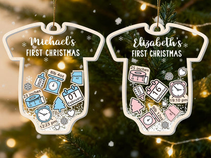 May include: Two baby onesie-shaped Christmas ornaments. One reads "Michael's FIRST CHRISTMAS" and the other "Elizabeth's FIRST CHRISTMAS". Each ornament has details like weight, length, date, and time. One baby measured 23 inches and the other 25 inches.