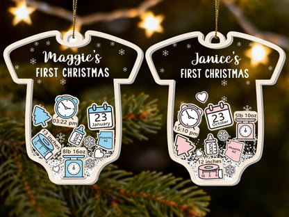 May include: Two baby onesie-shaped Christmas ornaments. One is blue and white, the other is pink and white. Each ornament has a baby's name and "FIRST CHRISTMAS" printed on it, along with birth details like time, date, and measurements.