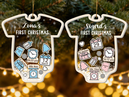 May include: Two baby-themed Christmas ornaments. One reads "Zona's FIRST CHRISTMAS" with birth details: 23 inches, 8lb 4oz, and 09:23 pm. The other reads "Sigrid's FIRST CHRISTMAS" with birth details: 16 inches, 5lb 19oz, and 16:12 pm.
