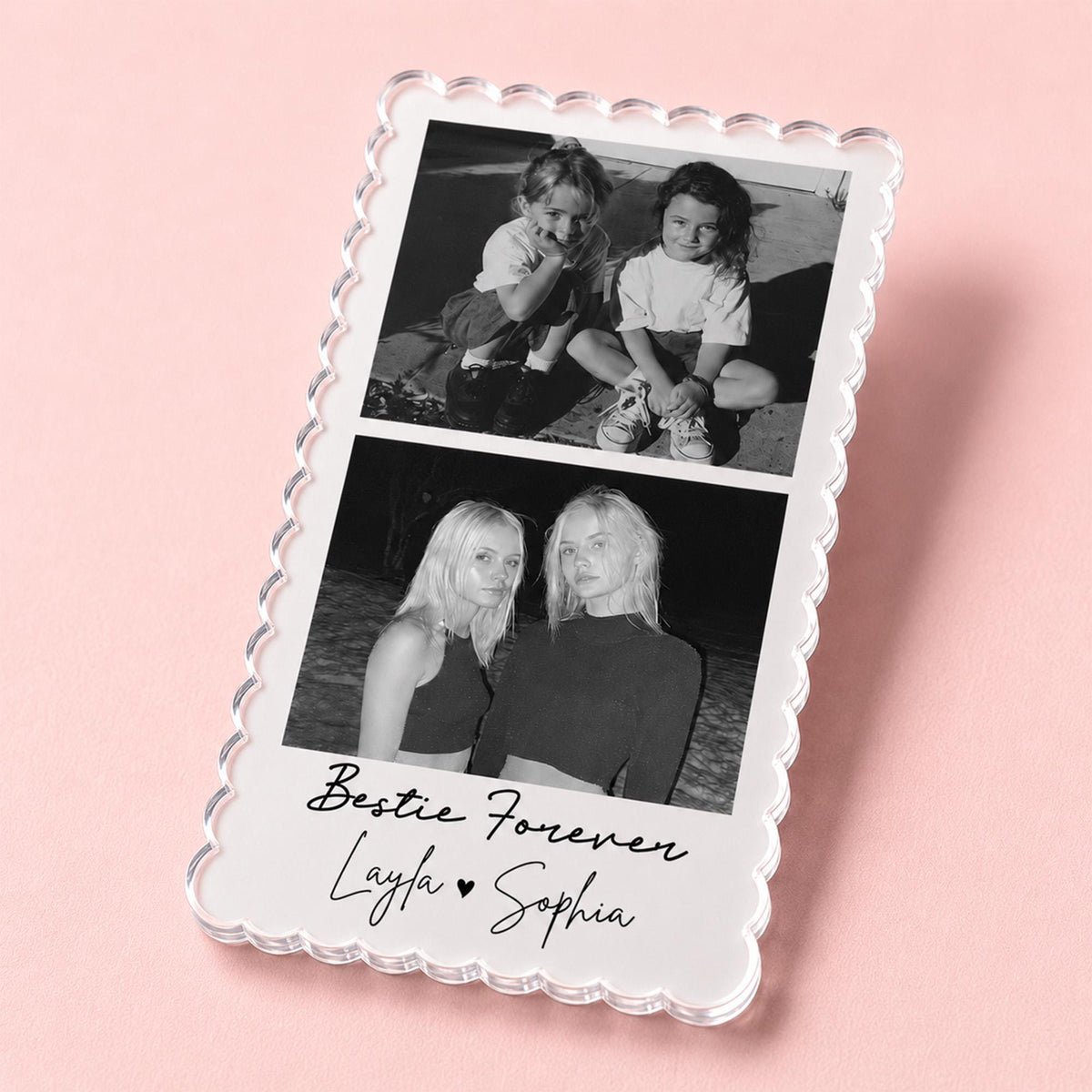 May include: A rectangular clear acrylic plaque with a scalloped edge featuring two black and white photographs stacked vertically. The bottom section displays the printed text Bestie Forever with the names Layla and Sophia separated by a heart.