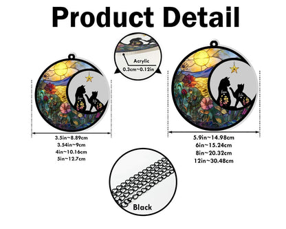 May include: Circular acrylic cat suncatcher with a black chain. The design features a silhouette of cats under a crescent moon with a star, set against a colorful sunset and floral background. The suncatcher is available in two sizes: 3.5 inches and 5.9 inches.