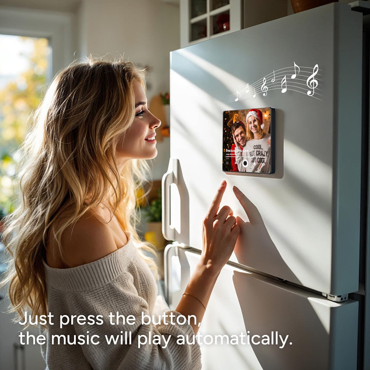 A woman presses a button on a photo frame with a picture of three people. The frame is attached to a white refrigerator. Music notes are visible above the frame. The text on the frame reads "Cool but Crazy at Once".