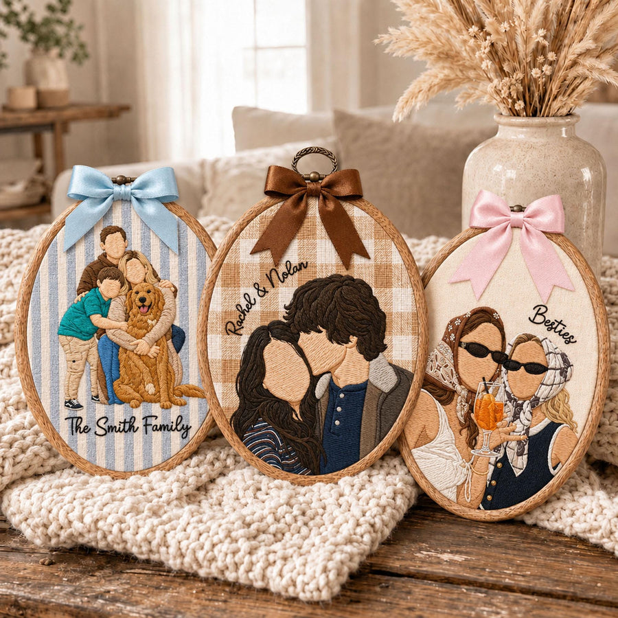 Three oval embroidery hoops featuring custom thread portraits. The left hoop shows a family with a dog on blue stripes with text The Smith Family. The center hoop shows a couple on beige plaid with text Rachel & Nolan. The right hoop shows two people with drinks on cream fabric with text Besties.