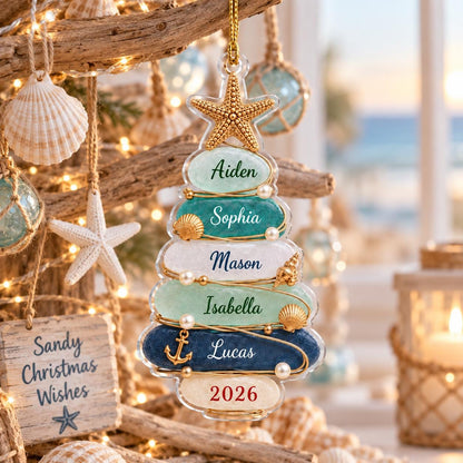 A clear, tree-shaped Christmas ornament featuring a gold starfish topper and six horizontal layers in shades of blue, green, and white. Each layer is personalized with names: Aiden, Sophia, Mason, Isabella, Lucas, and the year 2026.