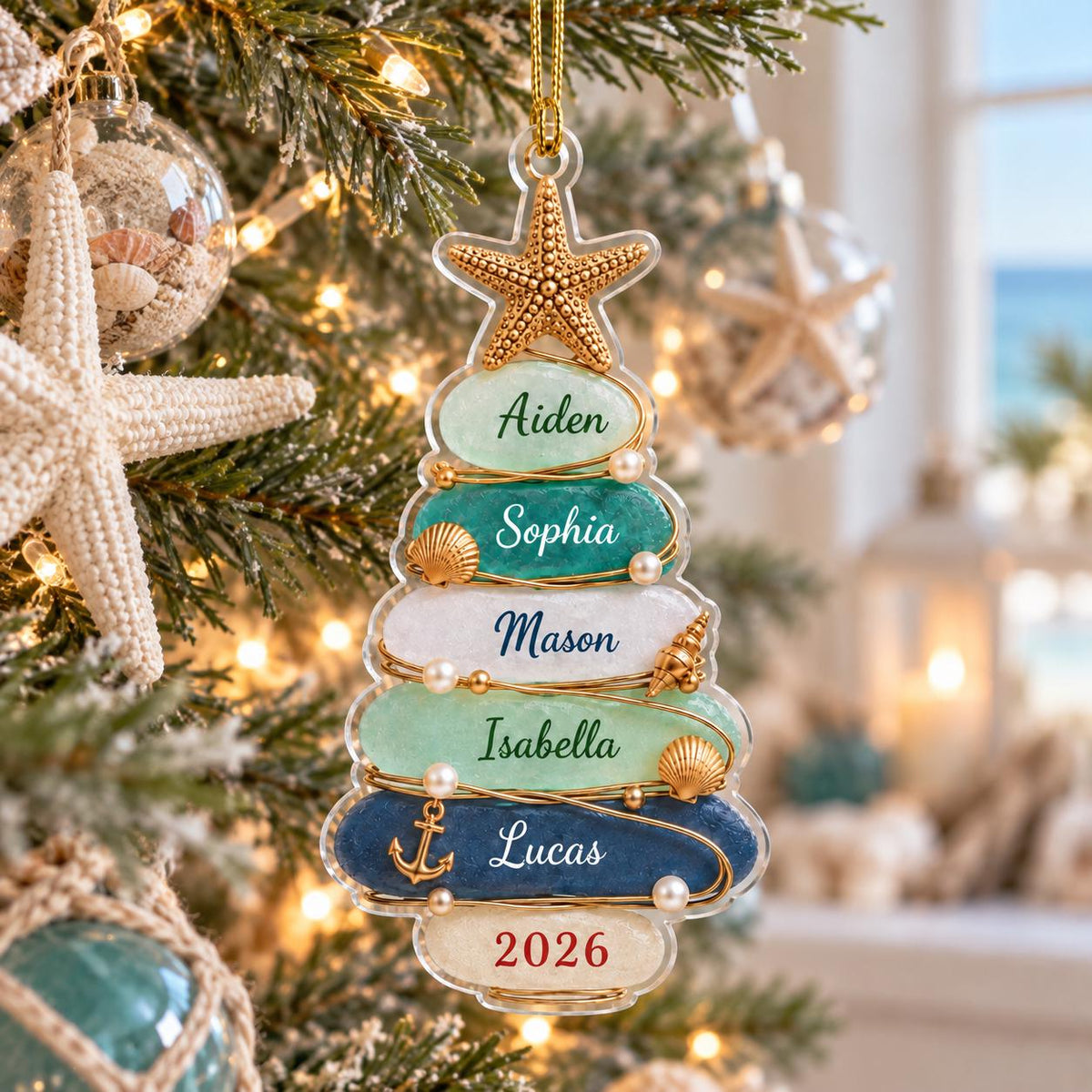 A clear, tree-shaped Christmas ornament featuring five horizontal layers in shades of light green, teal, white, mint, and navy blue. Each layer displays a name: Aiden, Sophia, Mason, Isabella, and Lucas, with 2026 at the base.
