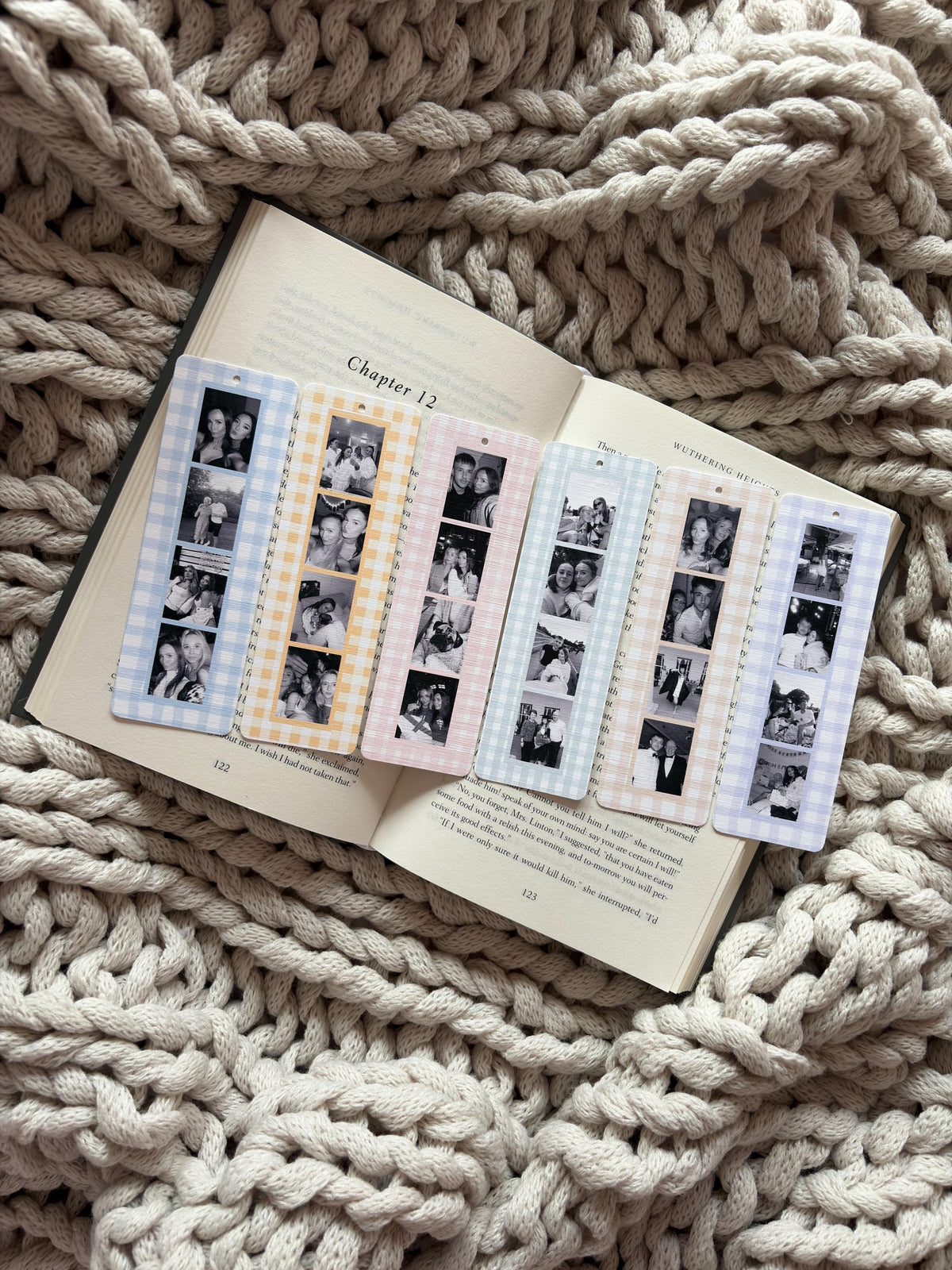 Six rectangular bookmarks with rounded corners, each featuring a vertical strip of four black and white photographs. The bookmarks have a gingham check border in blue, yellow, pink, light blue, peach, and purple, with a small hole at the top.