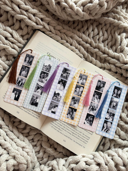 Six rectangular bookmarks with a gingham check pattern in various pastel colors, each featuring a vertical strip of four black and white photographs and a matching silk tassel attached to the top with a small metal eyelet.