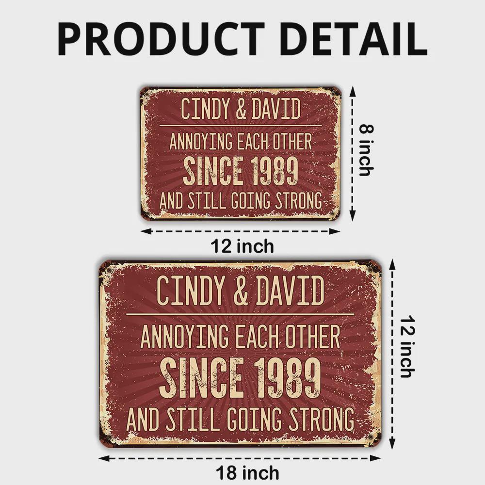 Two rectangular metal signs with distressed edges. The signs are red with white text that reads "CINDY & DAVID ANNOYING EACH OTHER SINCE 1989 AND STILL GOING STRONG." The larger sign is 18 inches long and 12 inches high.
