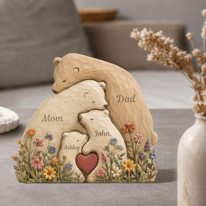 May include: A carved wooden family bear sculpture with the words "Mom", "Dad", "John", and "Ashley" inscribed. The bears are surrounded by colorful flowers and a red heart.