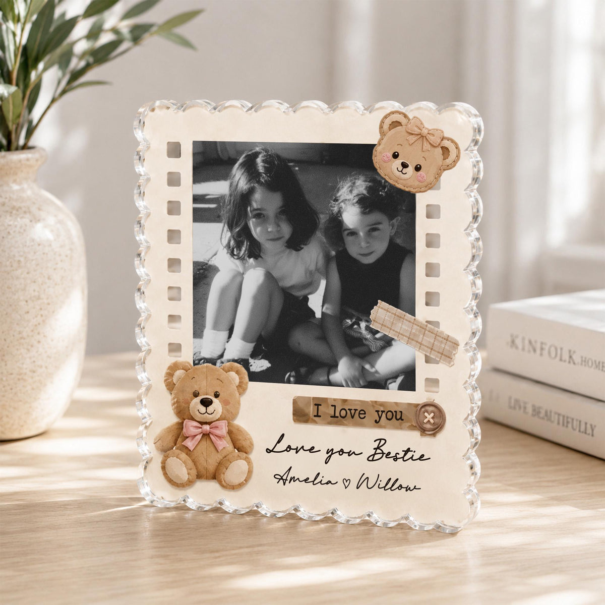 May include: A rectangular photo frame with a scalloped edge, featuring a black and white photograph of two children. The frame is decorated with a plush teddy bear, a bear face icon, and text that reads I love you, Love you Bestie, Amelia and Willow.