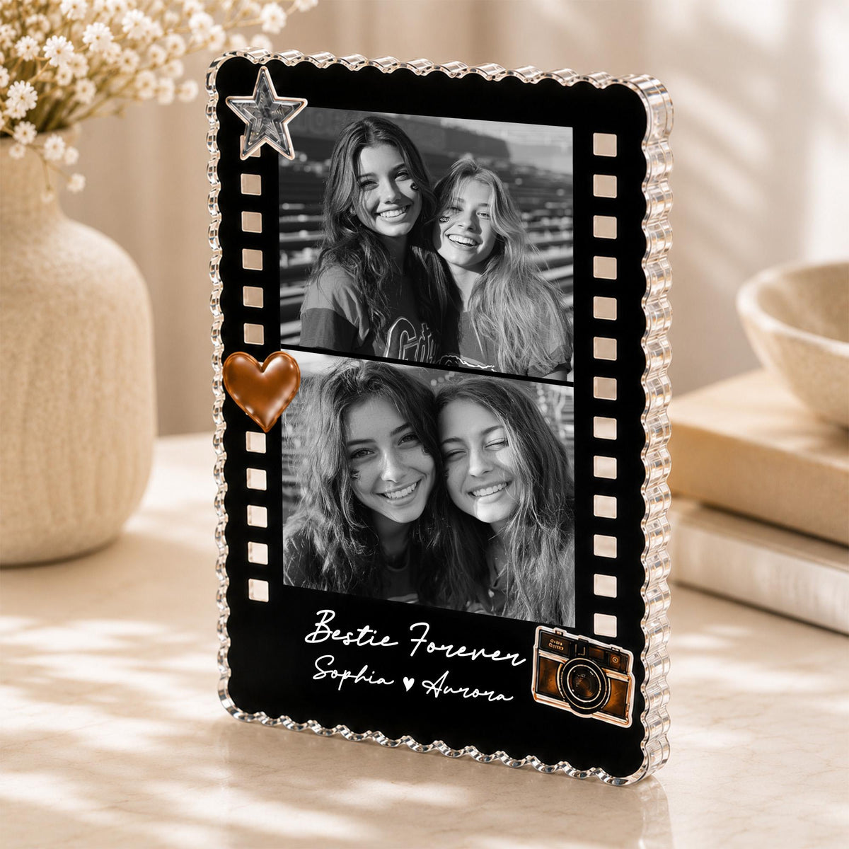 May include: A rectangular black acrylic photo frame with a scalloped edge, featuring two black and white photos of two people. The frame includes a silver star, a copper heart, and a camera graphic with the text Bestie Forever Sophia Aurora.