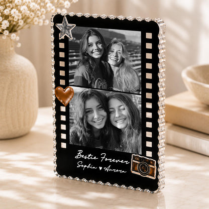 May include: A rectangular black acrylic photo frame with a scalloped edge, featuring two black and white photos of two people. The frame includes a silver star, a copper heart, and a camera graphic with the text Bestie Forever Sophia Aurora.