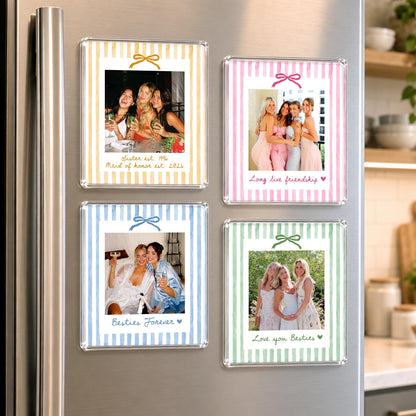 Four square acrylic refrigerator magnets featuring photo prints with pastel striped borders in yellow, pink, blue, and green. Each magnet displays a different group photo, a small bow graphic at the top, and handwritten-style text at the bottom.