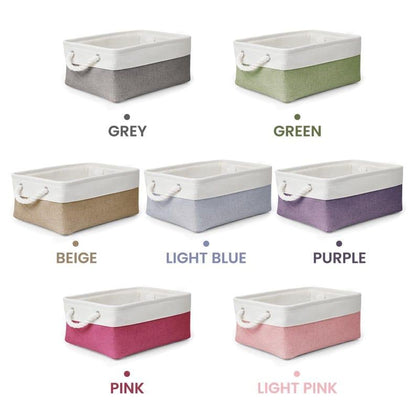 May include: Seven rectangular storage baskets with white rope handles and white upper rims. The lower sections are available in grey, green, beige, light blue, purple, pink, and light pink. Each basket features a textured fabric exterior.