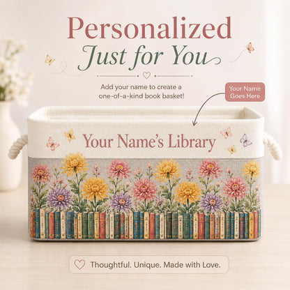 May include: A rectangular fabric storage basket with rope handles, featuring a printed design of colorful chrysanthemums above a row of vintage books. The text reads Personalized Just for You, Add your name to create a one-of-a-kind book basket!, Your Name Goes Here, Your Name’s Library, and Thoughtful. Unique. Made with Love.