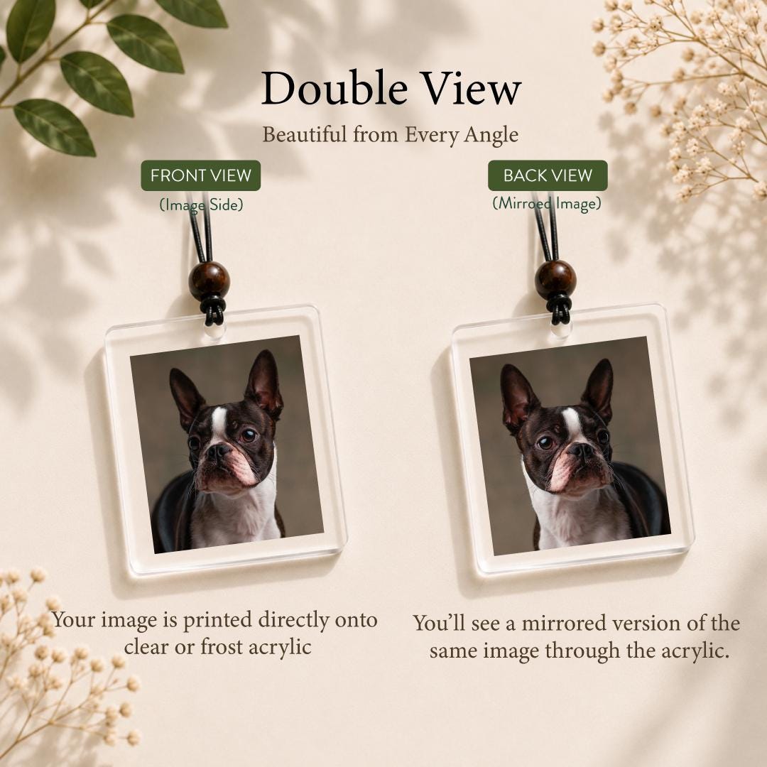 Two square acrylic ornaments featuring a portrait of a Boston Terrier. Each ornament hangs from a black cord with a dark wooden bead. The text reads Double View, Front View, Back View, and describes the printing on clear or frost acrylic.