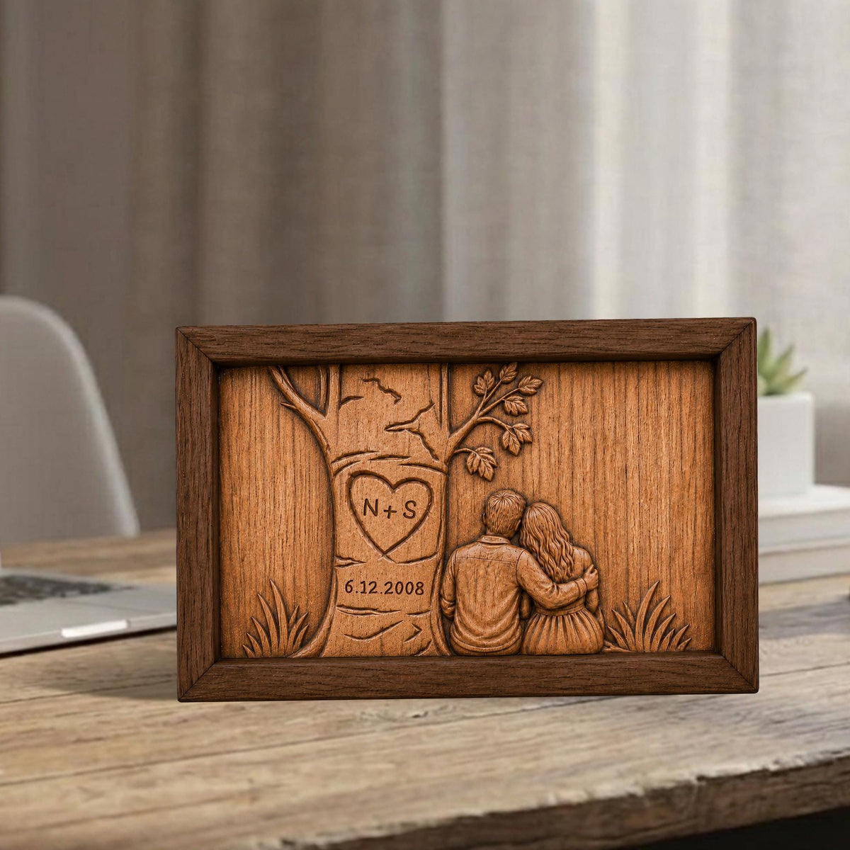 May include: A wooden framed artwork with a carved tree design. The tree has a heart with the initials "N + S" and the date "6.12.2008". The artwork depicts a couple embracing under the tree. The frame is brown.