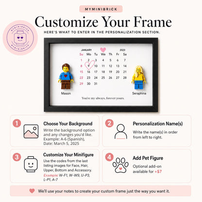 A black rectangular frame containing a white calendar print for January 2023 with a pink heart icon. Two plastic minifigures are attached to the print, labeled Mason and Seraphina, with the text You're my always, forever yours below.