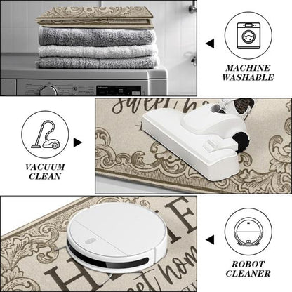 May include: A rectangular floor mat with a beige and brown ornate border and the text "sweet home" being cleaned by a white vacuum and a white robot vacuum. The mat is machine washable, as shown by a stack of towels on a washing machine.
