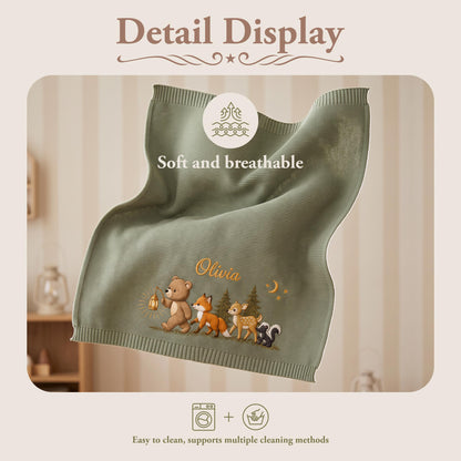 A sage green knitted blanket featuring the text "Detail Display", "Soft and breathable", and "Easy to clean, supports multiple cleaning methods". The blanket displays an embroidered scene of a bear, fox, deer, and skunk with the name "Olivia".