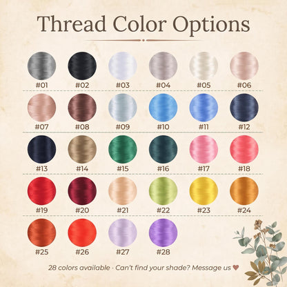 A color chart titled Thread Color Options displaying 28 circular thread samples in various shades including gray, black, white, blue, green, pink, red, yellow, and purple, each labeled with a number from #01 to #28 and text at the bottom.