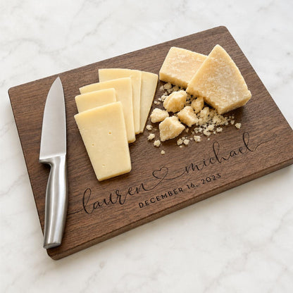 A wooden cutting board with a knife and cheese slices on it, along with a personalized message.