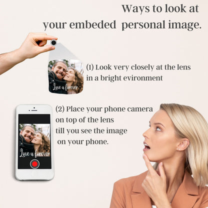 Image showing instructions on how to view an embedded personal image. A small lens is held up, projecting an image of a couple with the text "Love u forever." A smartphone displays the same image. Text explains how to view the image.