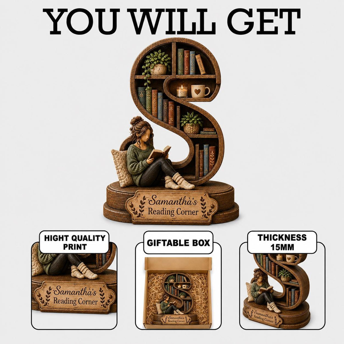 A brown, S-shaped bookshelf figurine featuring a person reading a book, with shelves holding miniature books, plants, and a mug. A plaque reads 'Samantha's Reading Corner'. The item has a 15mm thickness and comes in a giftable box.