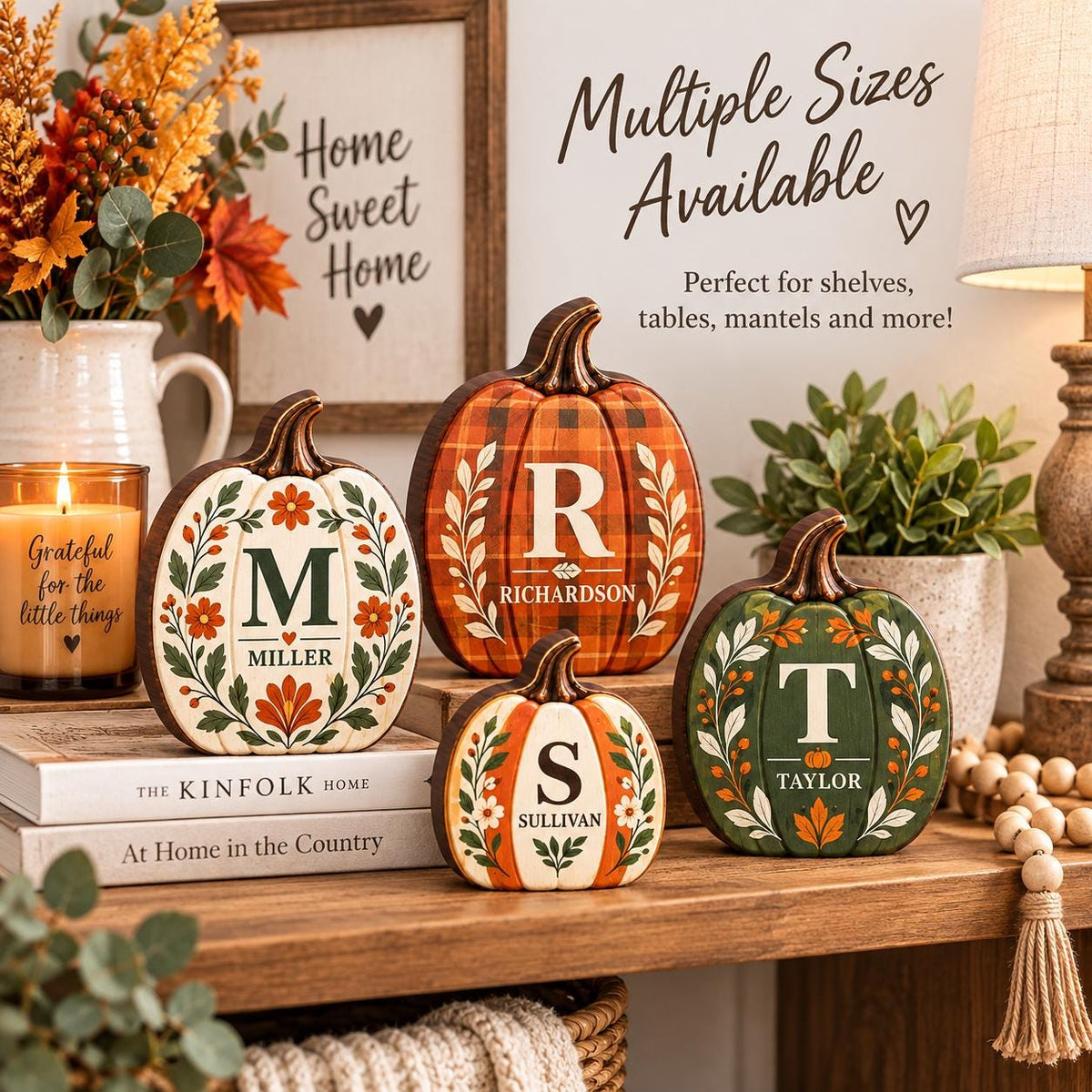 May include: Four decorative wooden pumpkins in varying sizes, each featuring a unique letter and name. The pumpkins display orange, green, and white colors with floral and plaid patterns. Text on the pumpkins includes M Miller, R Richardson, S Sullivan, and T Taylor.