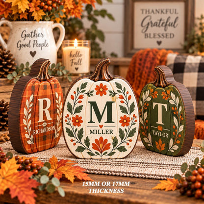 May include: Three decorative wooden pumpkins with a thickness of 15mm or 17mm. The left pumpkin is orange plaid with the letter R and Richardson. The center is white with floral patterns, the letter M, and Miller. The right is green with the letter T and Taylor.