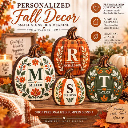May include: Four personalized pumpkin-shaped wooden signs featuring various letters and family names. The pumpkins are decorated with painted floral patterns, plaid textures, and autumn-themed colors including orange, green, white, and brown.