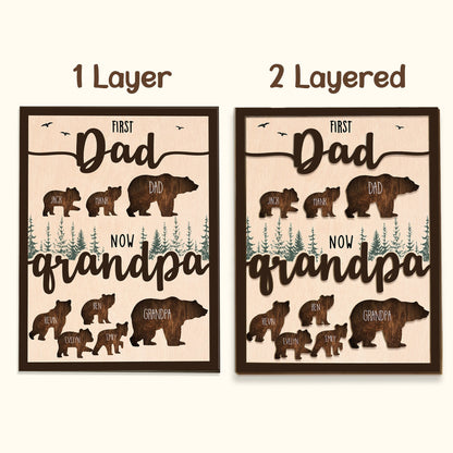 May include: A wooden sign with the text "First Dad Now Grandpa" and bear silhouettes. The sign features the names of the children and grandchildren. The sign is available in one or two layers.