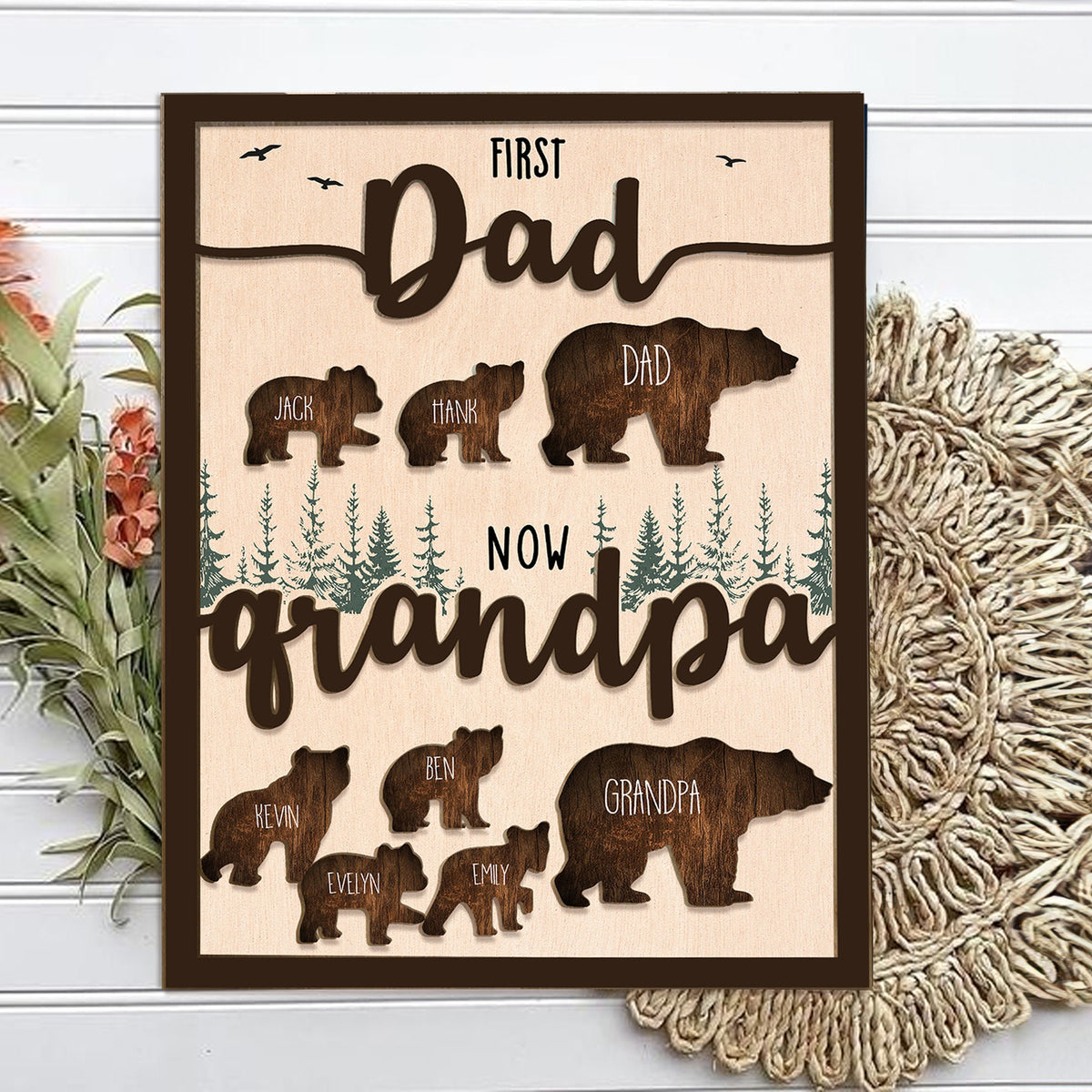 May include: A wooden sign with the text "First Dad Now Grandpa" and a silhouette of a bear family. The bear silhouettes are labeled with names like "Jack", "Hank", "Dad", "Kevin", "Ben", "Evelyn", "Emily", and "Grandpa".