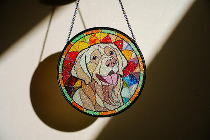 May include: A round stained glass window hanging from a chain. The window features a colorful mosaic design with a white labrador retriever dog in the center.