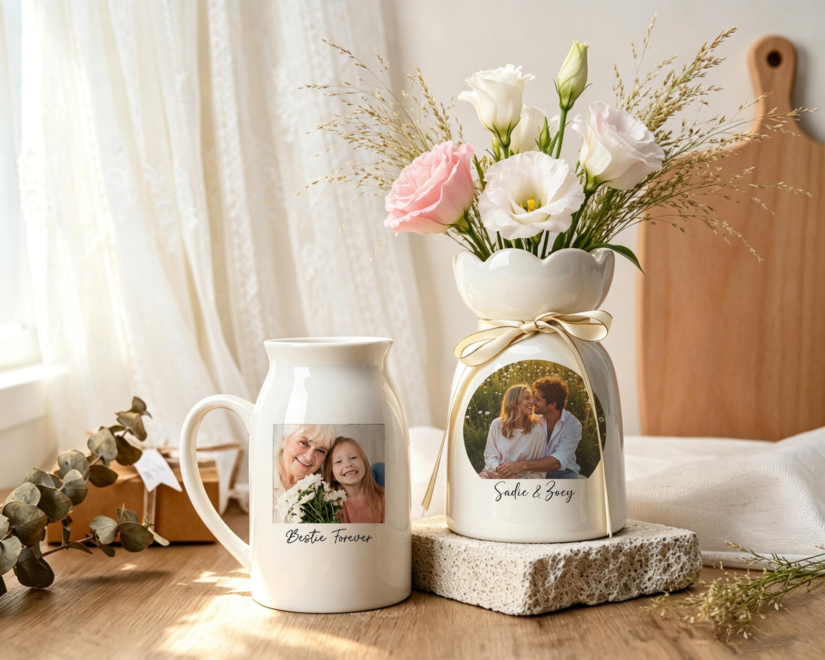 A white ceramic mug and a matching white ceramic vase, both featuring custom photo prints. The mug displays a photo of two people with the text "Bestie Forever," while the vase holds flowers and shows a photo with "Sadie & Zoey."