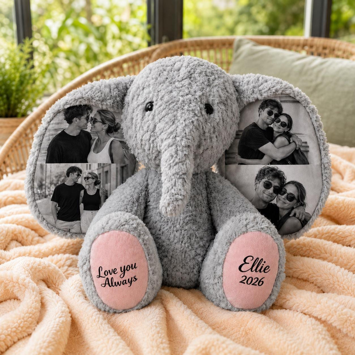 A gray plush elephant toy with large ears featuring printed black and white photographs of couples. The elephant has pink foot pads with the text Love you Always on the left foot and the name Ellie and the year 2026 on the right foot.