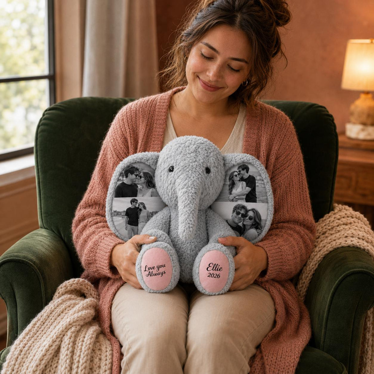 A gray plush elephant toy featuring two large ears printed with black and white photographs of couples. The elephant has pink foot pads with the text Love you Always on the left foot and the name Ellie and the year 2026 on the right foot.