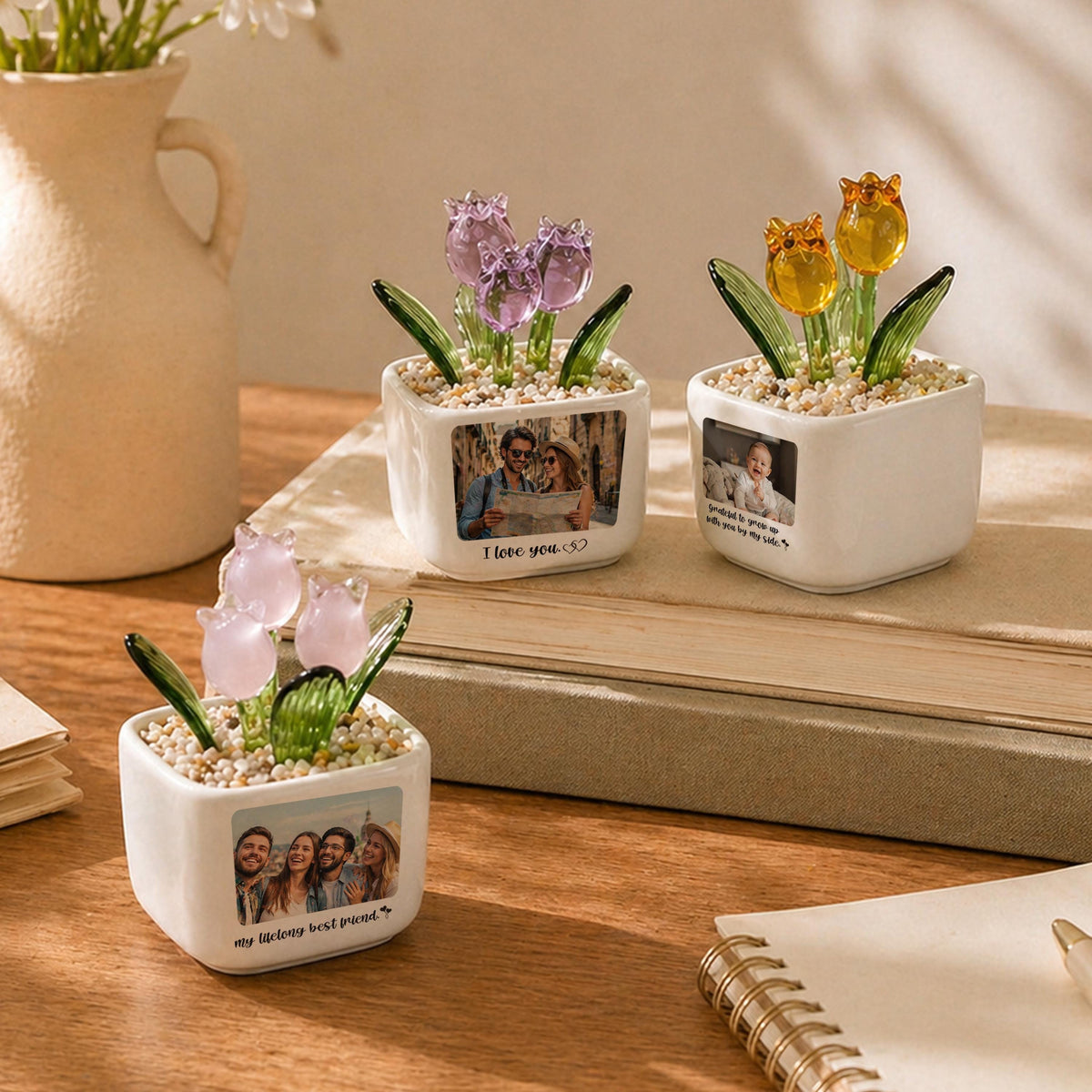 Three small, white ceramic pots, each containing glass tulip flowers in purple, yellow, and pink. Each pot features a printed photograph and text: "I love you.", "...to grow up with you by my side.", and "my lifelong best friend."