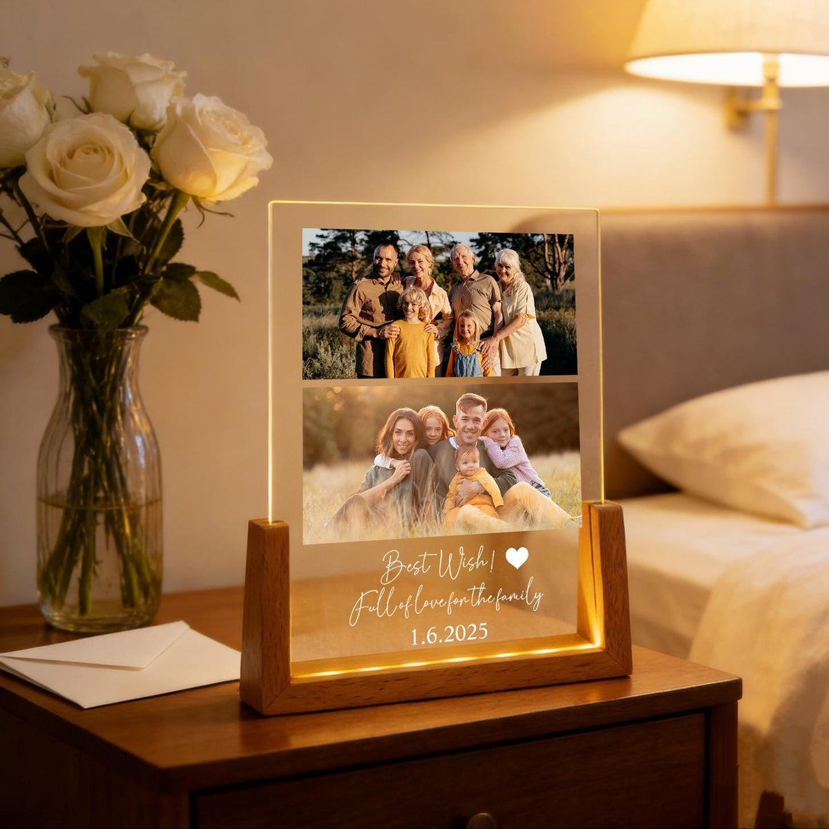 A lighted photo display with two family photos. The display has a wooden base and a clear acrylic front. The text "Best Wish! Full of love for the family 1.6.2025" is illuminated on the front.