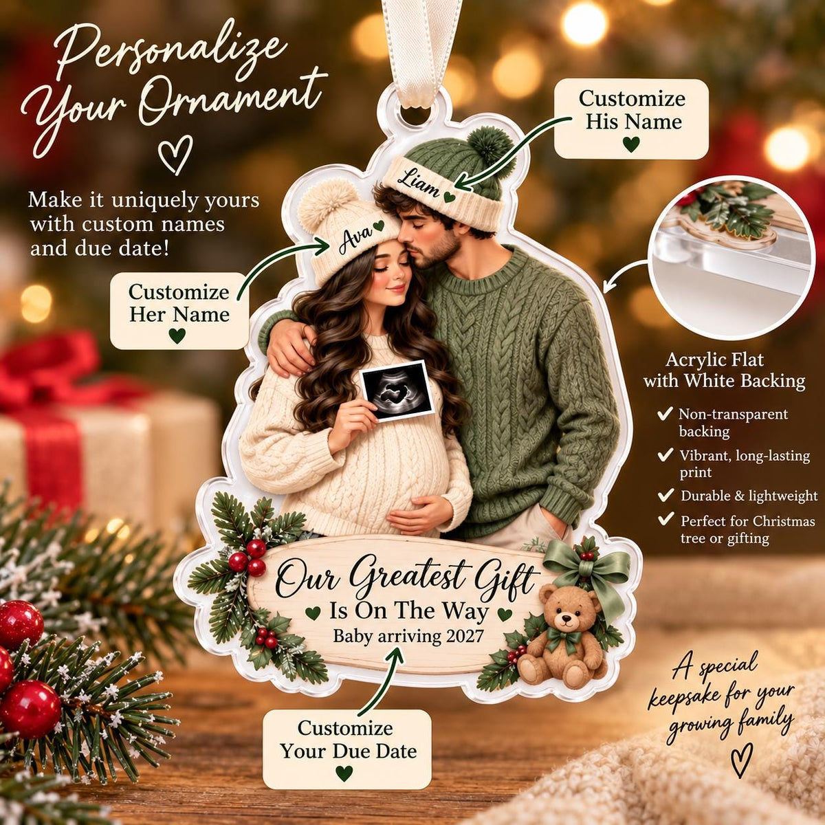 May include: A custom acrylic Christmas ornament featuring a couple wearing knit hats and sweaters, holding an ultrasound image. The ornament includes the text 'Our Greatest Gift Is On The Way' and 'Baby arriving 2027', decorated with pine branches, red berries, and a teddy bear.