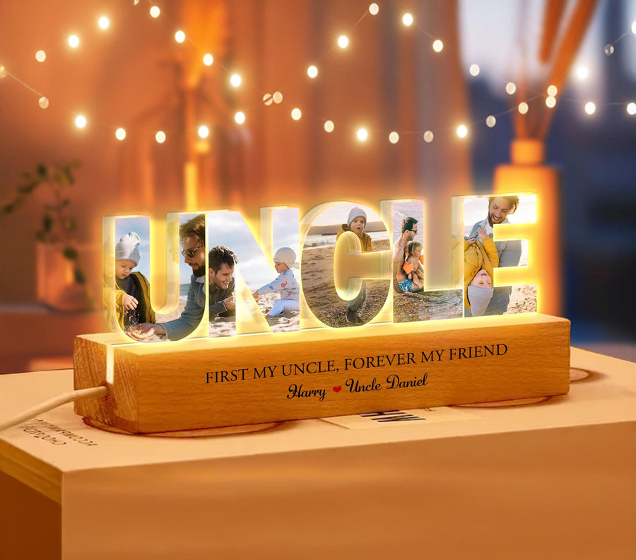 May include: A wooden light-up sign spelling "UNCLE" with photos of a family inside each letter. The base of the sign has the text "First my uncle, forever my friend Harry Uncle Daniel".