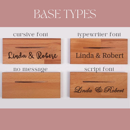 Four wooden plaques with different font styles. The plaques are labeled "cursive font", "typewriter font", "no message", and "script font". Each plaque has the text "Linda & Robert" engraved on it.