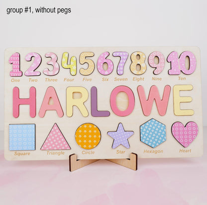 A rectangular wooden puzzle board featuring the numbers one through ten in various pastel patterns, the name HARLOWE in large colorful letters, and six shapes including a square, triangle, circle, star, hexagon, and heart.