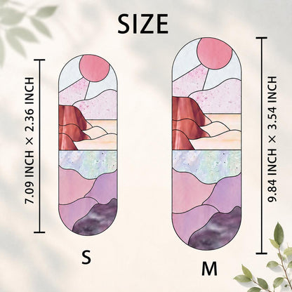 Two stained glass art pieces in a landscape design. The smaller piece is 7.09 inches tall and 2.36 inches wide, while the larger is 9.84 inches tall and 3.54 inches wide. The design features a pink sun, mountains, and purple and pink hues.
